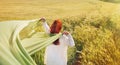 Fashion red hair woman standing back hands up with green fabric Royalty Free Stock Photo