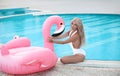 Fashion blond model woman in white bikini posing on Pink in Royalty Free Stock Photo