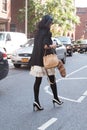 A Fashion show guest crossing the street in New York city Royalty Free Stock Photo