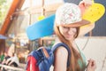 Fashion skateboarder young woman with a skateboard. Adventure, summer trip.