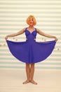 Fashion smiling woman shows blue dress skirt in dance shop. crazy woman in funny pose of ballerina dancer. funny crazy