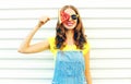 Fashion smiling young woman holding a slice of watermelon in the form of ice cream