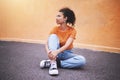 Fashion, sneakers and young woman on street in the city. Portrait of urban, trendy and black female model against an Royalty Free Stock Photo