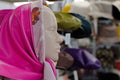 Fashion still life. mannequin head in bright pink leather scarf