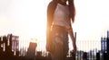 Fashion street casual with woman model with sunset on roof top garden Royalty Free Stock Photo