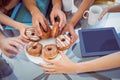 Fashion students eating doughnuts Royalty Free Stock Photo