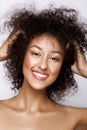 Fashion studio portrait of beautiful african american woman with perfect smooth glowing mulatto skin, make up Royalty Free Stock Photo