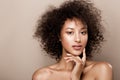 Fashion studio portrait of beautiful african american woman with perfect smooth glowing mulatto skin, make up Royalty Free Stock Photo