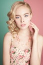 Blonde woman with color makup on colorful background