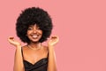 Fashion studio portrait of beautiful smiling woman with afro curls hairstyle. Beauty face of cheerful girl. Real people emotions Royalty Free Stock Photo