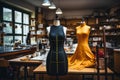 In the fashion studio, a tailors dummy stands adorned with measuring tapes