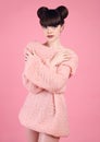 Fashion studio teen look style over pink. Fashionable young girl