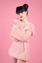 Fashion studio teen look style over pink. Fashionable young girl