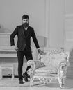 Fashion and style concept. Man with beard and mustache wearing classic suit, stylish fashionable outfit. Macho Royalty Free Stock Photo