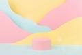 Fashion style paper abstract stage mockup with pink circle podium, pastel mountain landscape - yellow, mint color, sunbeam glare.