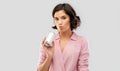 Woman drinking soda from can with paper straw Royalty Free Stock Photo