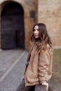 Fashion style portrait. beautiful stylish girl with long hair walks in the city. Portrait of attractive girl on the Royalty Free Stock Photo