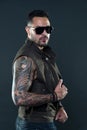 Fashion style and trend. Tattooed man with biceps and triceps. Tattoo model with beard on unshaven face. Bearded man