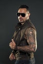 Fashion style and trend. Tattooed man with biceps and triceps. Tattoo model with beard on unshaven face. Bearded man