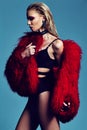 Fashion stylish swag model in fur coat Royalty Free Stock Photo