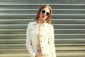 Fashion stylish woman in sunglasses and white denim jacket Royalty Free Stock Photo