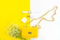 Fashion stylish yellow bag and woman accessories pastel background. Trendy fashion luxury handbag, Royalty Free Stock Photo