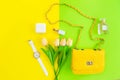 Fashion stylish yellow bag and woman accessories pastel background. Royalty Free Stock Photo