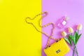 Fashion stylish yellow bag and woman accessories pastel background. Trendy fashion luxury handbag Royalty Free Stock Photo