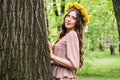 Fashion Summer Model Girl with Long Blowing Hair. Summer Beautiful Woman with Healthy and Beauty Brown Hair with Green Grass on Royalty Free Stock Photo