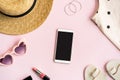 Fashion summer women`s clothes set with accessories on pink background with empty screen smart phone, Flat lay, Top view Royalty Free Stock Photo