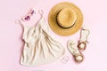 Fashion summer women`s clothes set with accessories on pink background, Flat lay, Top view Royalty Free Stock Photo