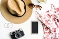 Fashion summer women`s clothes set with accessories on white background with empty screen smart phone, Flat lay, Top view Royalty Free Stock Photo