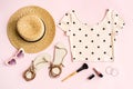 Fashion summer women`s clothes set with cosmetics and accessories on pink background, Flat lay, Top view Royalty Free Stock Photo