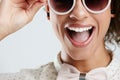Fashion, sunglasses and face of woman with smile on white background for summer, casual and trendy style. Creative