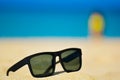 Fashion sunglasses on sea beach. Summer holiday relax background with copy space