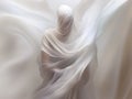 Silhouette of a woman draped with white sensual flowing flying silk cloth. illuminated