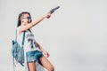 Fashion swag girl holding gun woman having