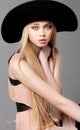 Fashion teen model in a black big hat Royalty Free Stock Photo