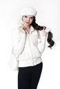 Fashion teen white style look. Fashionable young girl wears fur Royalty Free Stock Photo