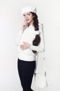 Fashion teen white style look. Fashionable young girl wears fur Royalty Free Stock Photo