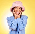 Fashion, tongue and face of Indian woman on yellow background with silly, goofy and playful expression. Emoji, happiness