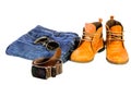 Fashion trend - jeans, leather shoes, leather belt with buckle o Royalty Free Stock Photo