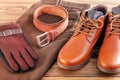 Fashion trend for man- jeans, leather shoes, leather belt, gloves Royalty Free Stock Photo