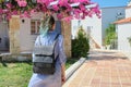 Fashion trendy girl with blue hair with backpack walking