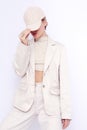 Fashion Urban Girl. Stylish Details of everyday outfit. Casual beige aesthetics.Trendy accessories velvet cap. Minimalistic style Royalty Free Stock Photo