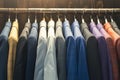 Fashion variety Colorful mens suits hanging in a store display Royalty Free Stock Photo