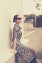 Fashion vintage style - beautiful elegant woman in leopard dress Royalty Free Stock Photo