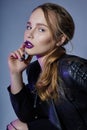 Fashion Vogue girl makeup purple lipstick, woman in leather jack