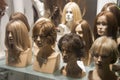 Wigs on a mannequins in a shop window Royalty Free Stock Photo