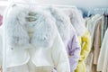 Fashion winter coats hanged on a clothes rack Royalty Free Stock Photo